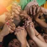united hands of multiracial people, anti racism concept