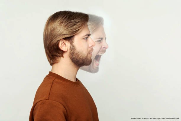 LES TROUBLES DISSOCIATIFS : QUAND LE CERVEAU SE DÉCONNECTE DE LA RÉALITÉ POUR SURVIVRE 6 Profile side view portrait of two faced bearded man in calm serious and angry screaming expression. different emotion inside and outside mood of people. indoor studio shot, isolated on grey background